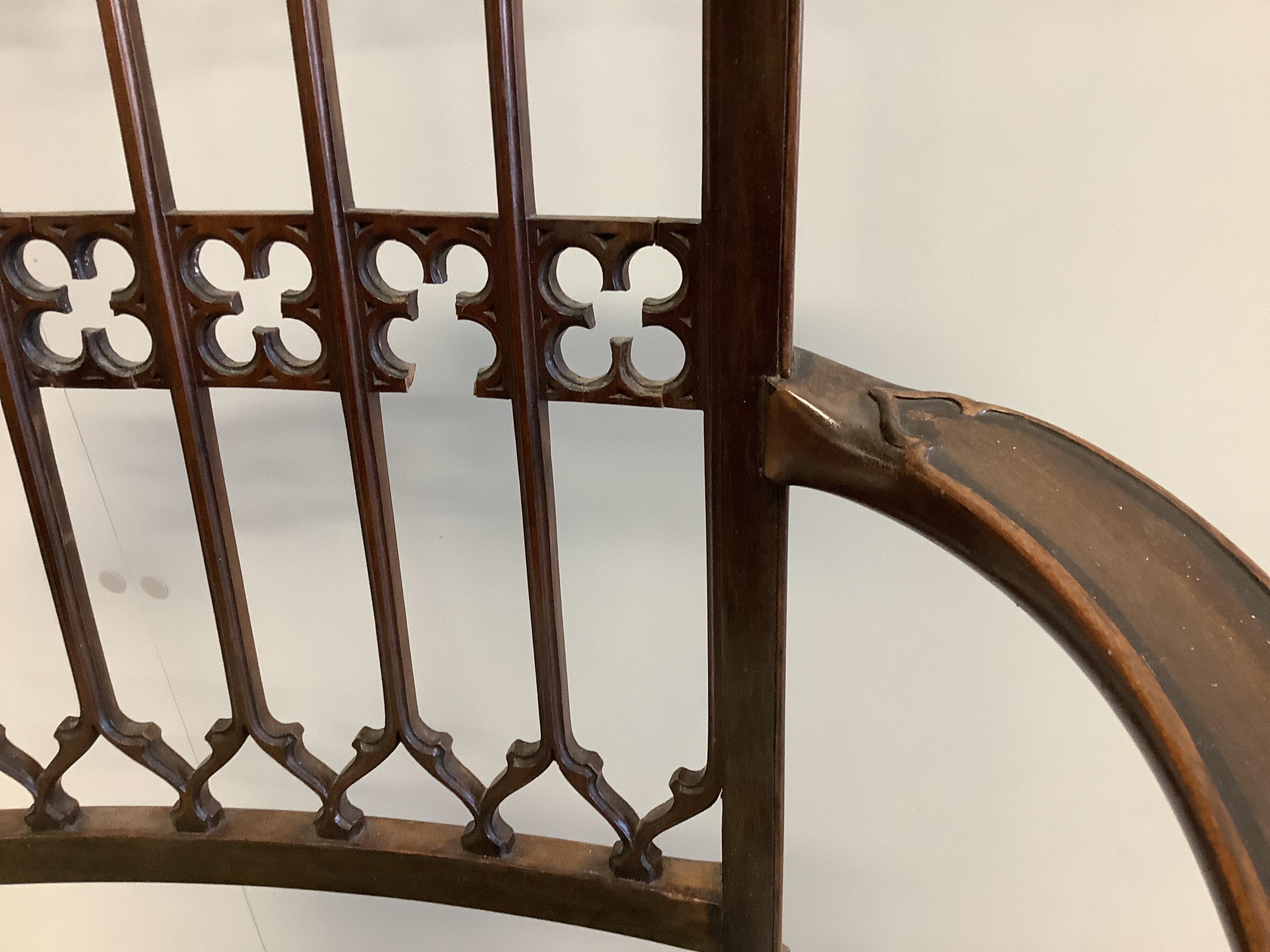 An Edwardian Gothic Revival mahogany elbow chair, width 58cm, depth 42cm, height 95cm